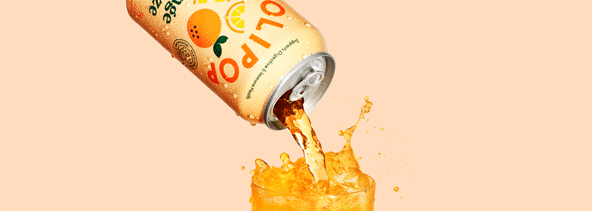 A can of olipop orange squeeze that is being poured into a glass.